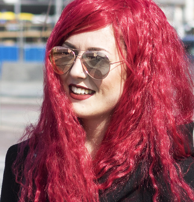 Lady in red with glasses