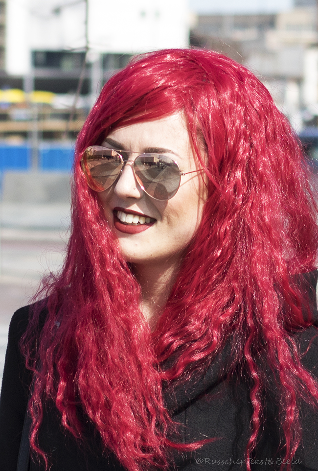 Lady in red with glasses